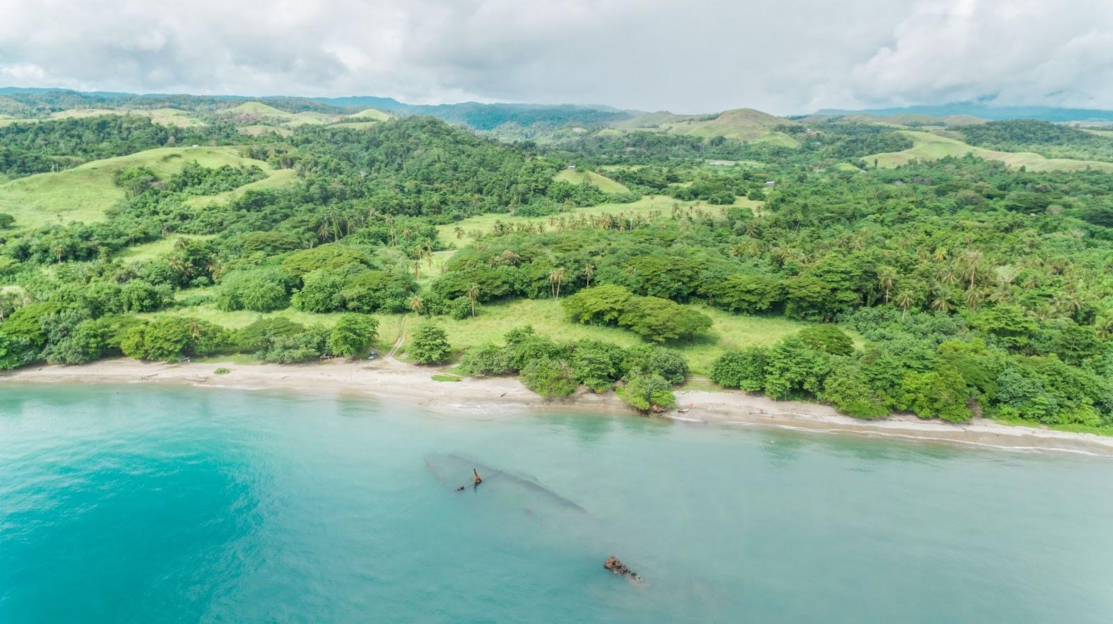 Aerial view of the World War 2 shipwreck of a Japanese transport ship (Kinugawa Maru) that lies just off Bonege ii beach on Guadalcanal island. Solomon Islands