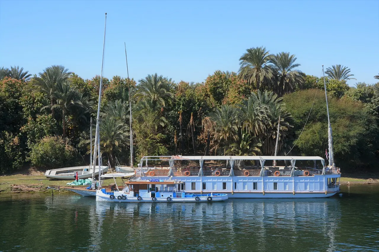 Tourists taking a ferry boat cruise on the river Nile. Costs paid for with travel money at the best exchange rates from Manor FX