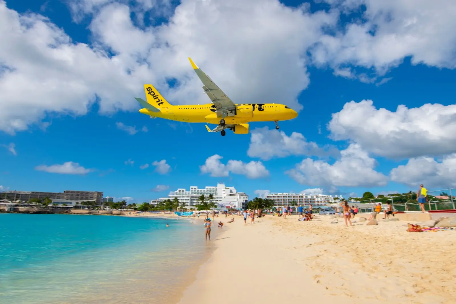Spirit Airlines Airbus 320 flying over Maho Beach