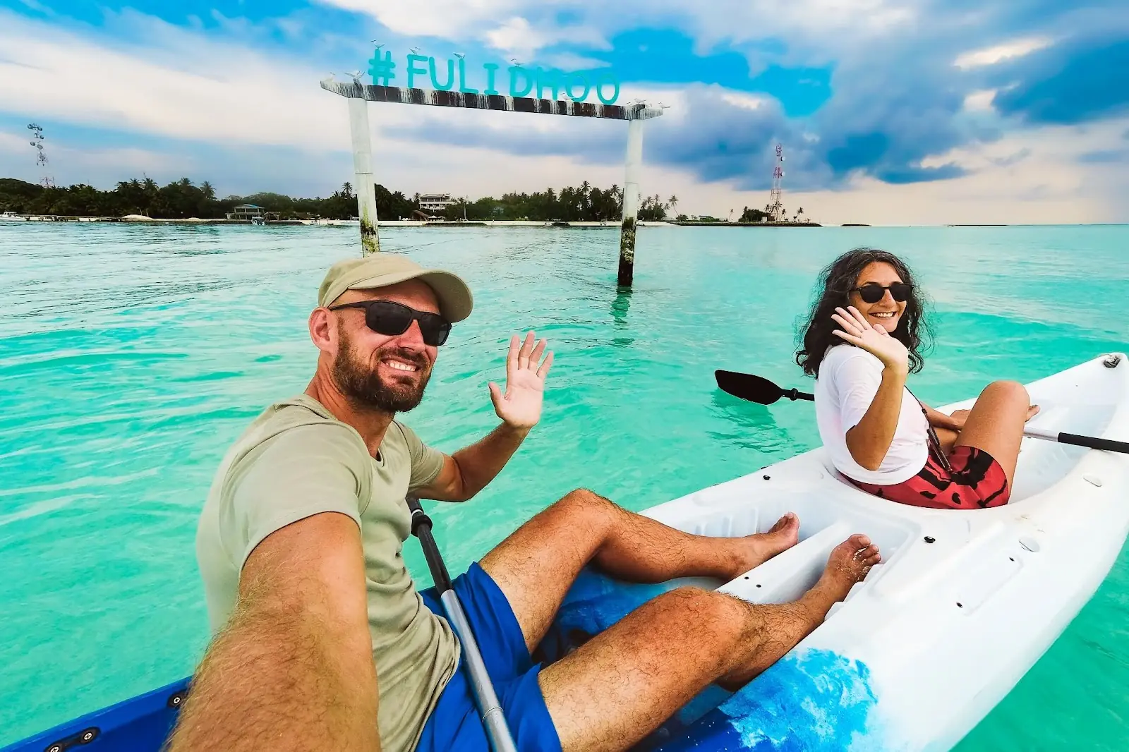 Couple taking selfie on kayak