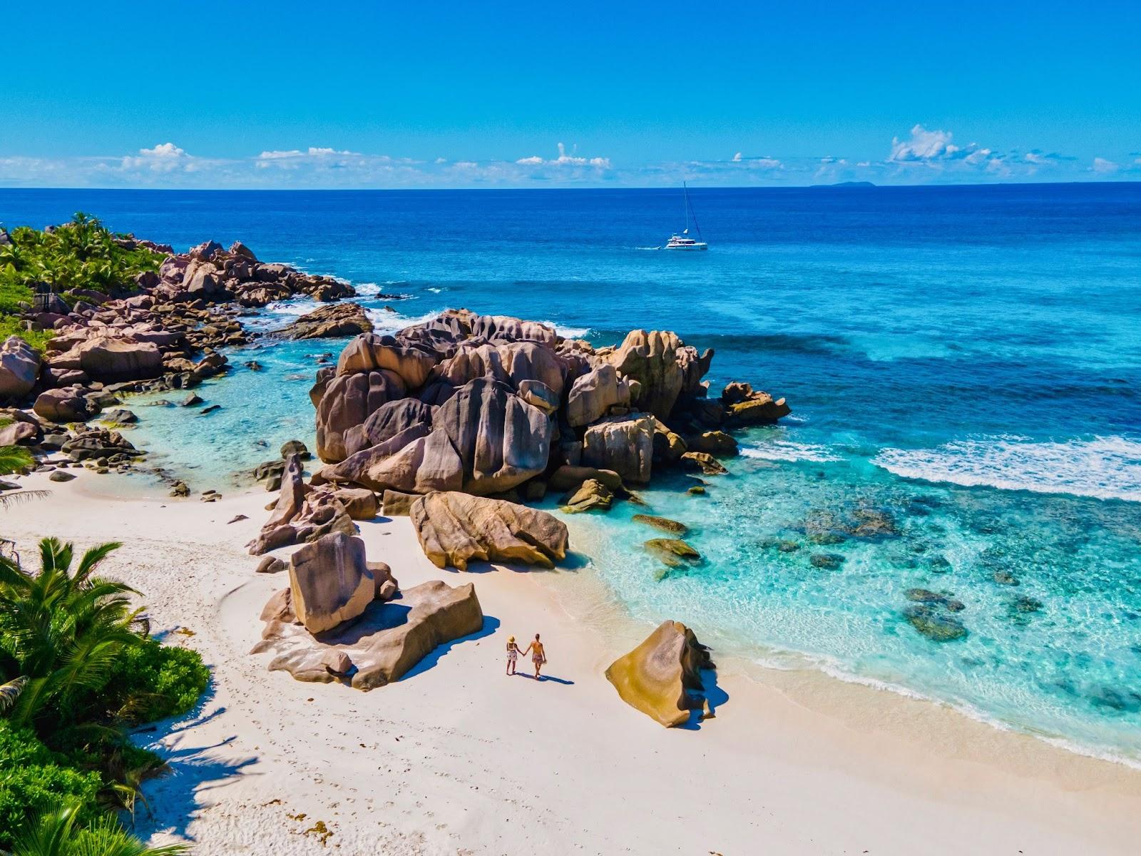 Anse Source d'Argent beach, La Digue Island, Seyshelles, Drone aerial view of La Digue Seychelles bird eye view.of tropical Island. mature couple men and women on vacation Seychelles