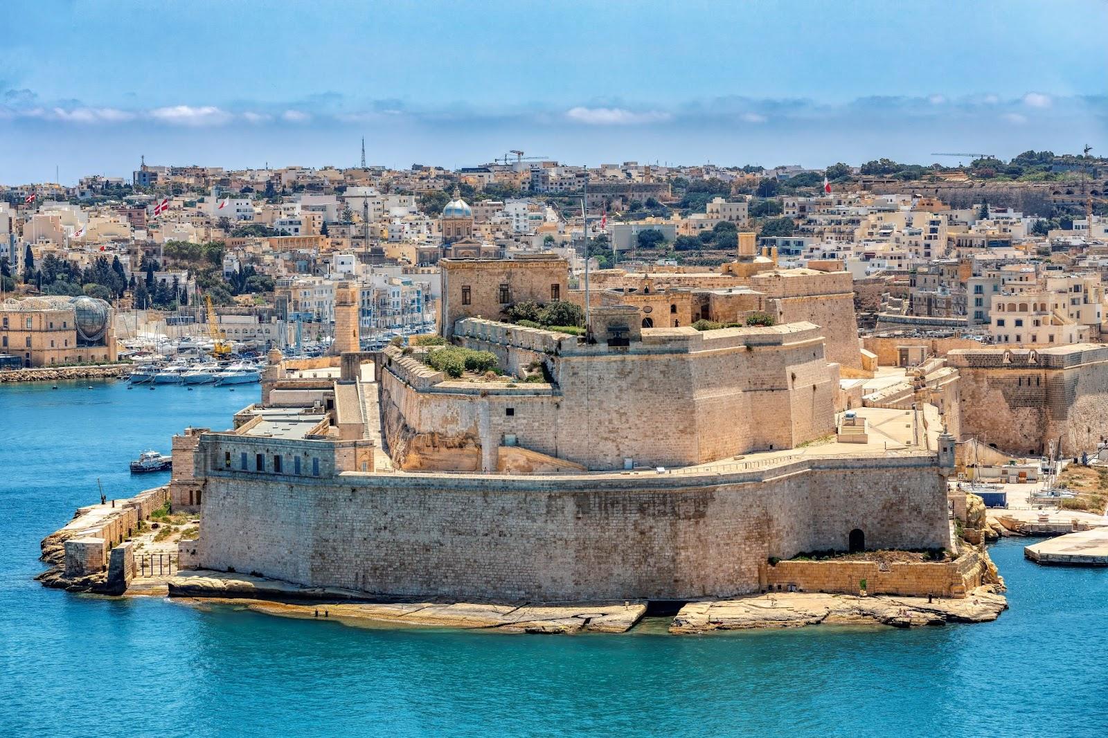 Fort St. Angelo, symbol of Malta's resilience, majestic stone walls, silent witness to rich history. Port in Birgu. View from Fort Saint Elmo. Cultural heritage of Malta