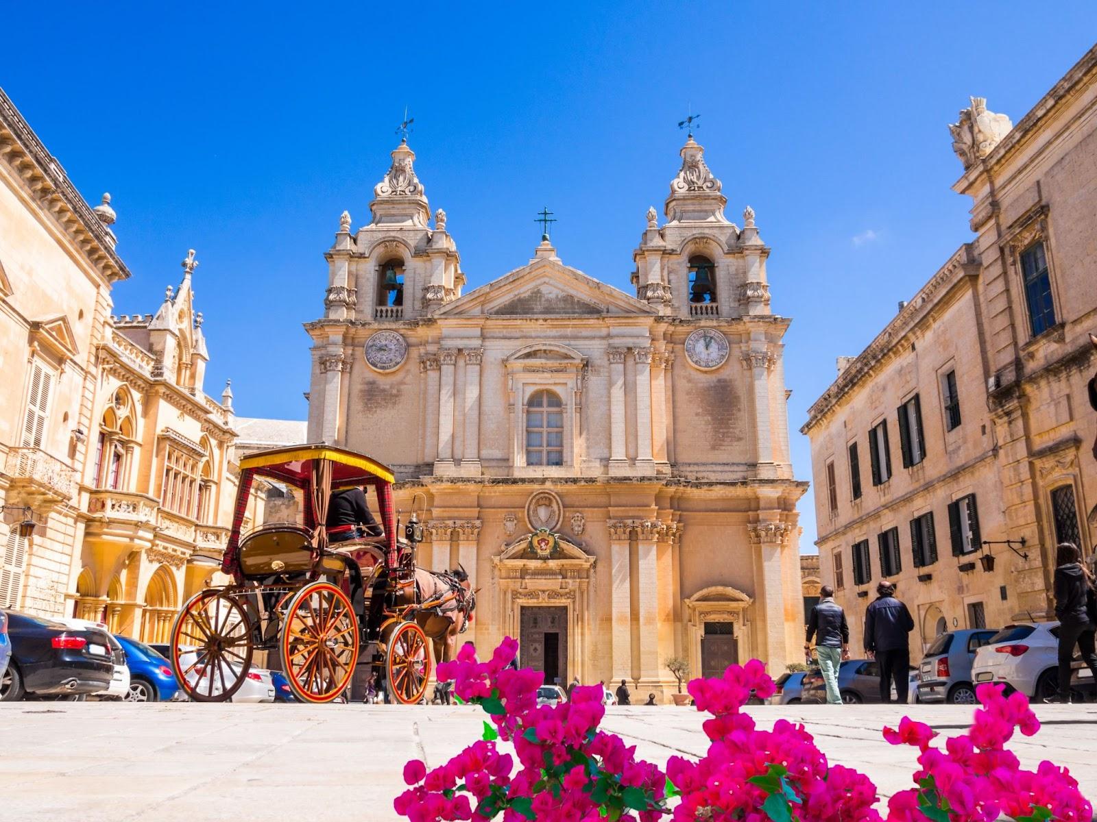 Historic Roman Catholic Cathedral of Saint Paul in main town square of Mdina village in Malta, Europe