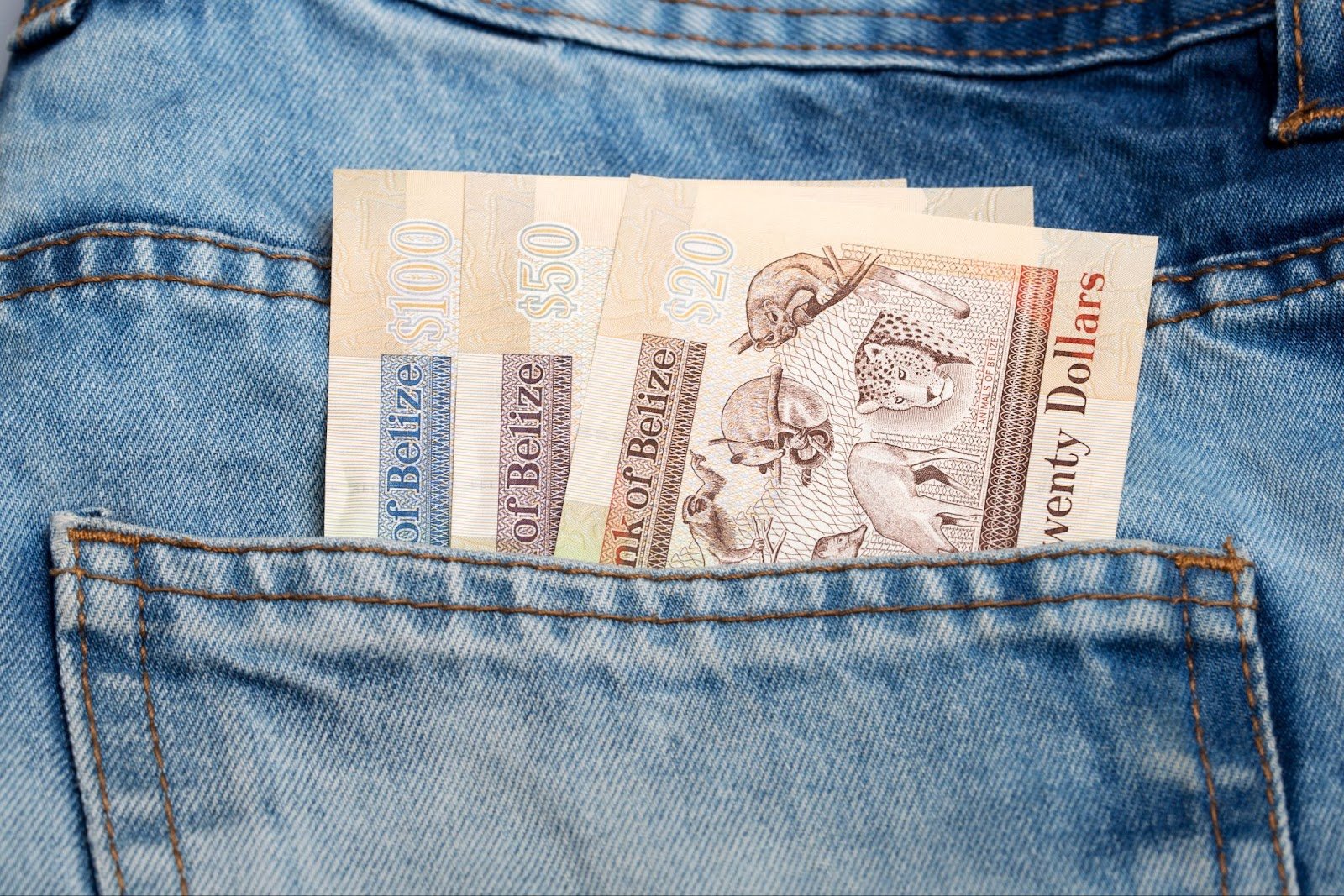 Belize dollars in jeans pocket