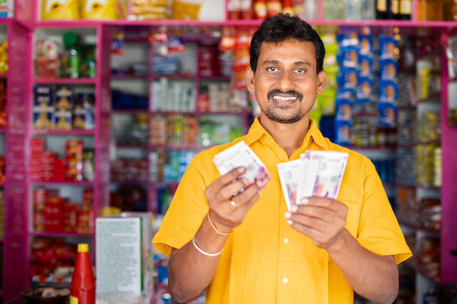Shop keeper with rupee notes