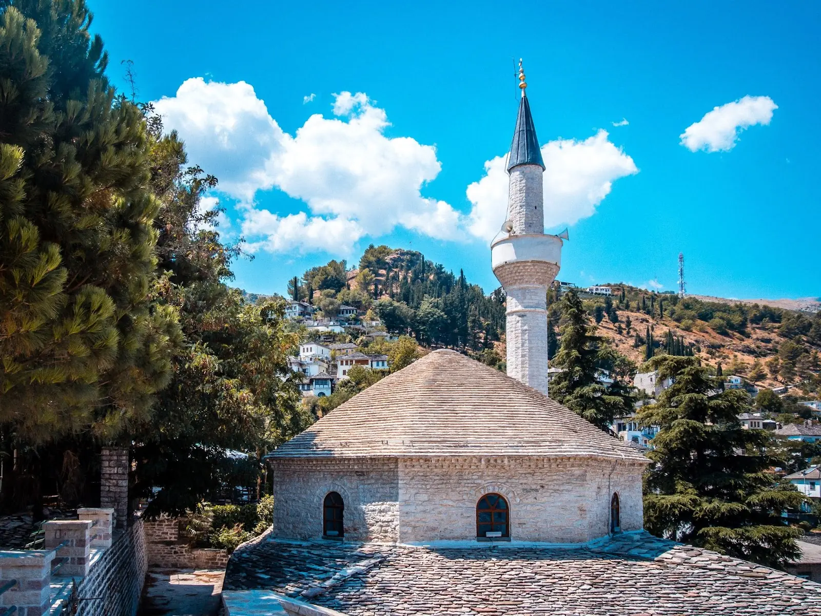 An Albanian church on the side of a hill.