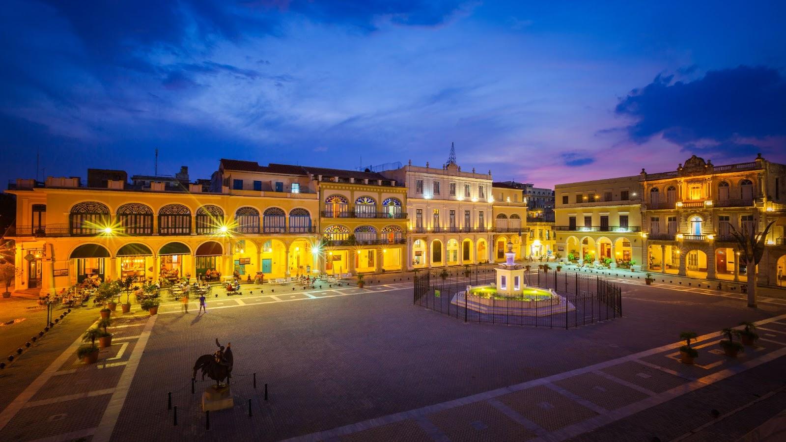 The Old Square, Plaza Vieja in Spanish, at twilight, Old Havana, Cuba.