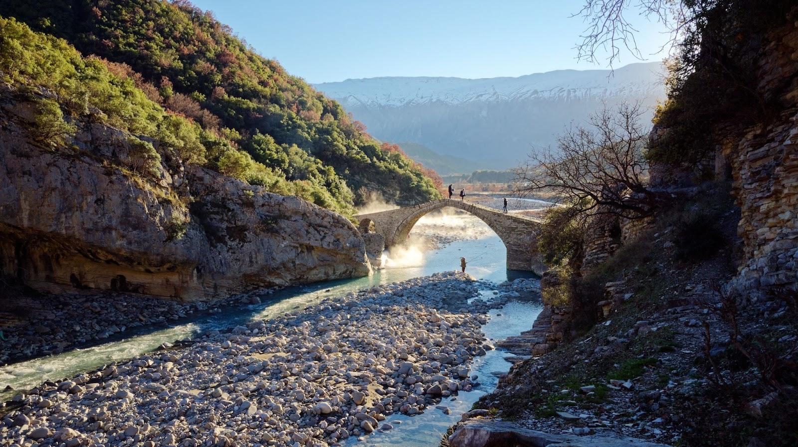 People crossing the Kadiut Bridge in Benje, Permet, Albania