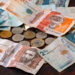 Colombian notes and coins on a table