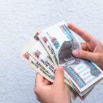 Woman counting Egyptian pounds