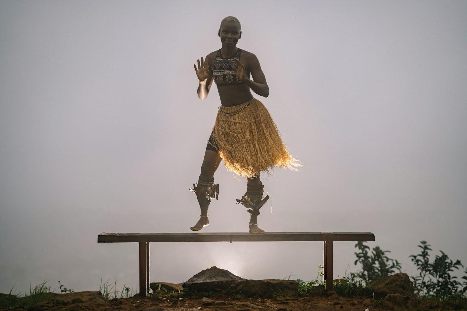 Young African dancer performing traditional dance. Freetown, Sierra Leone